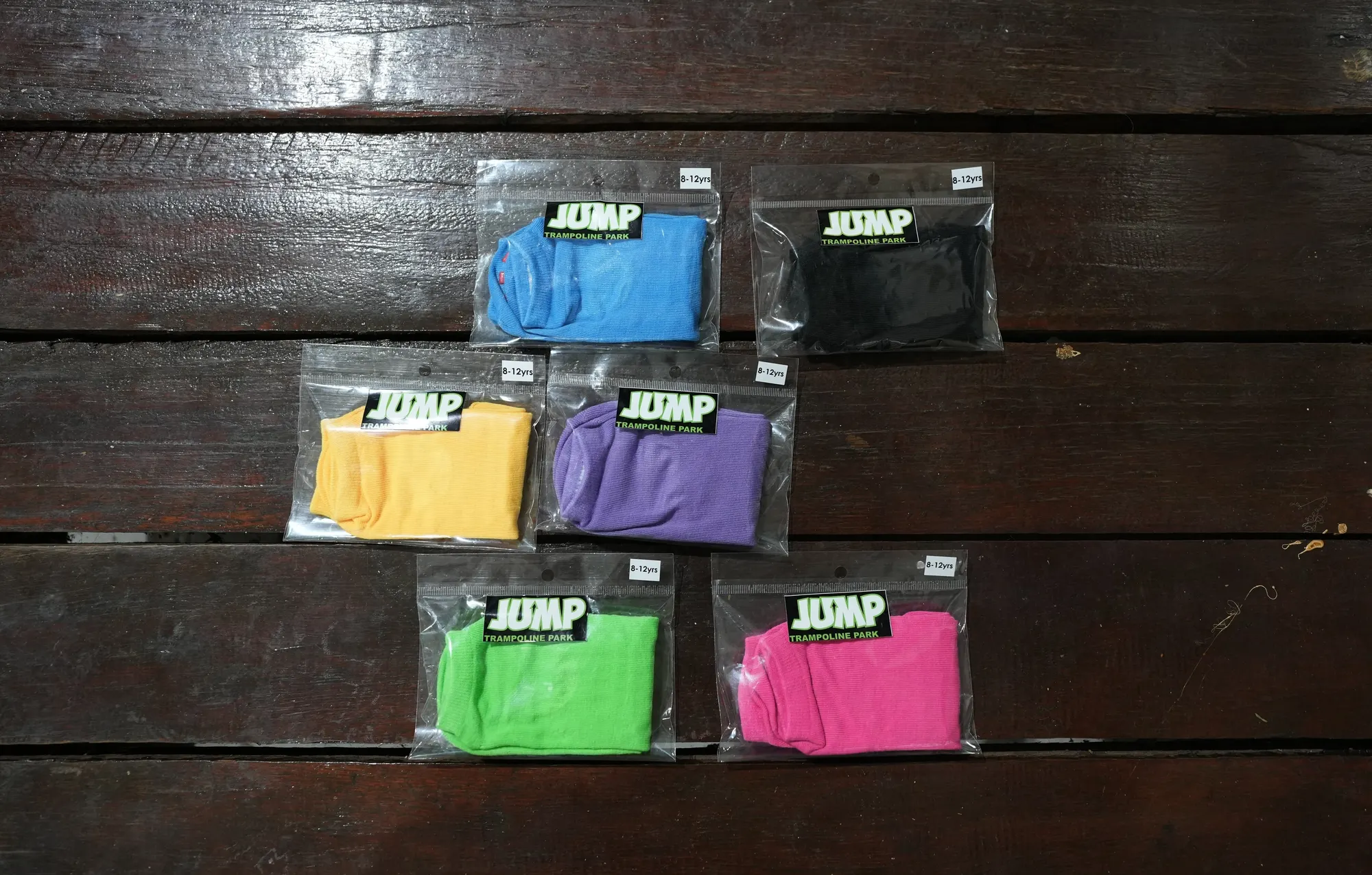 Packaged Jump socks in blue, black, yellow, purple, green and pink